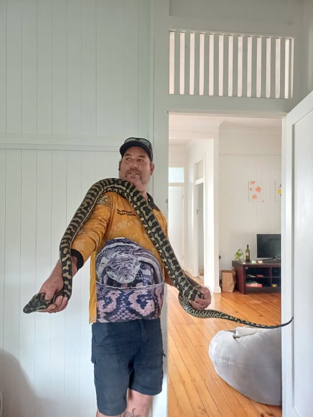 Robert Watson relocating a snake