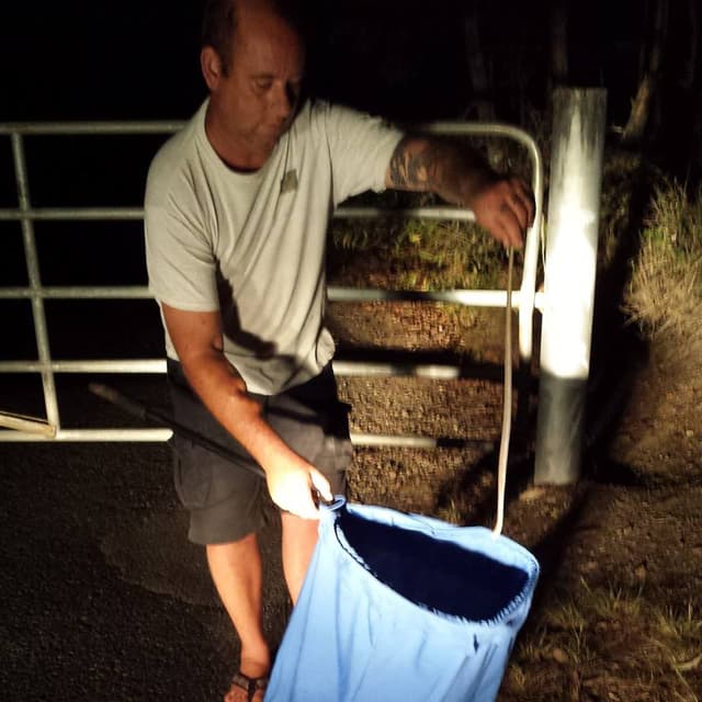 Robert Watson with snake catching equipment